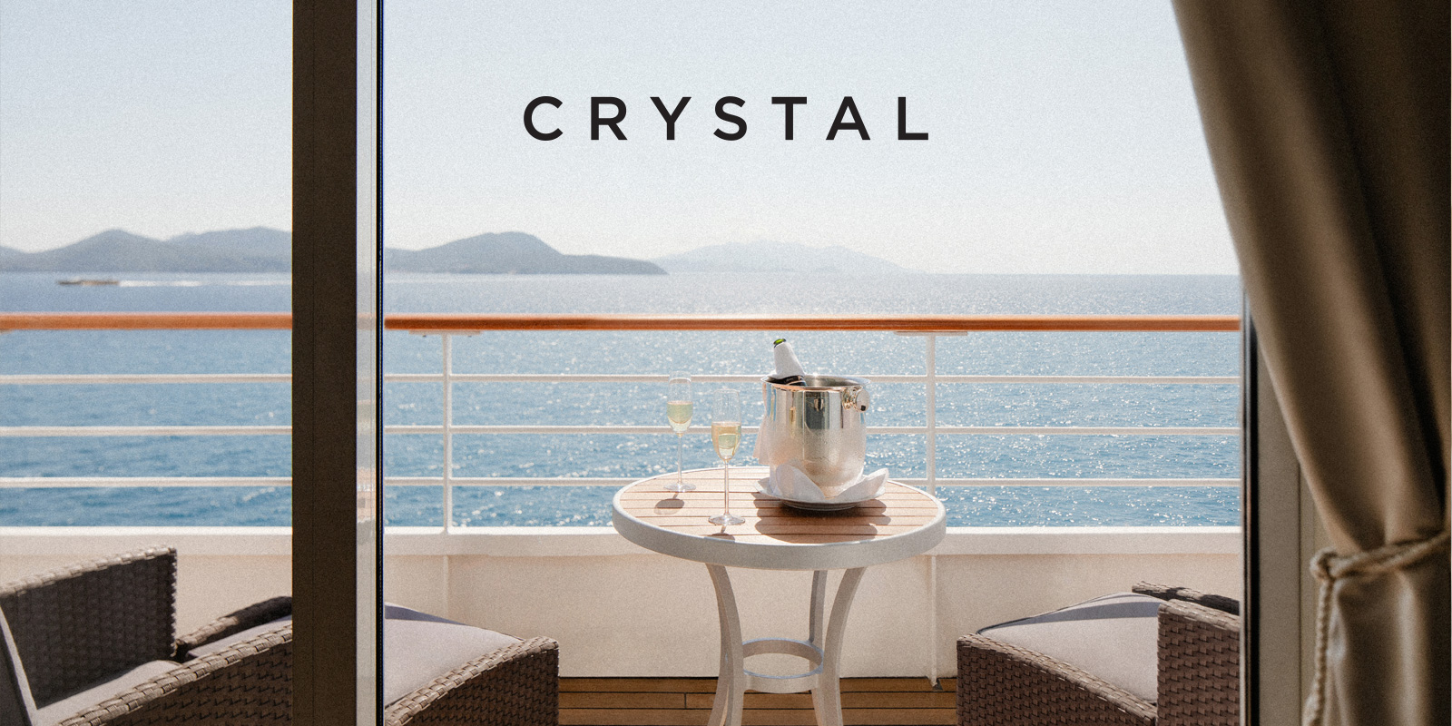 Couple enjoying the view from the rail onboard Crystal Serenity