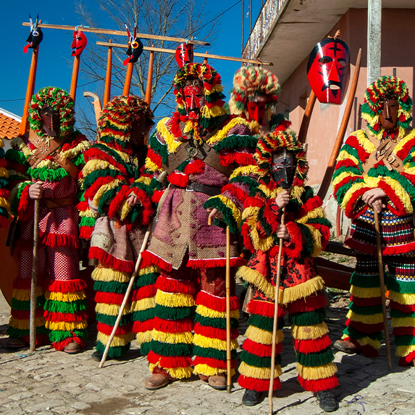 People in traditional costumes at the Carnival of Podence