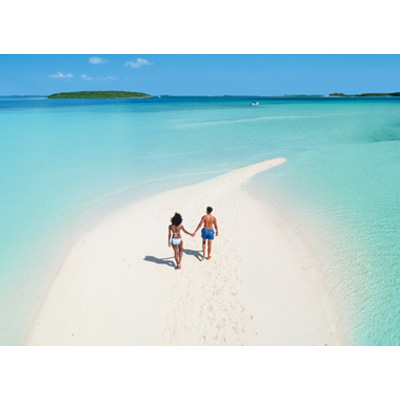 Couple walking by the beach