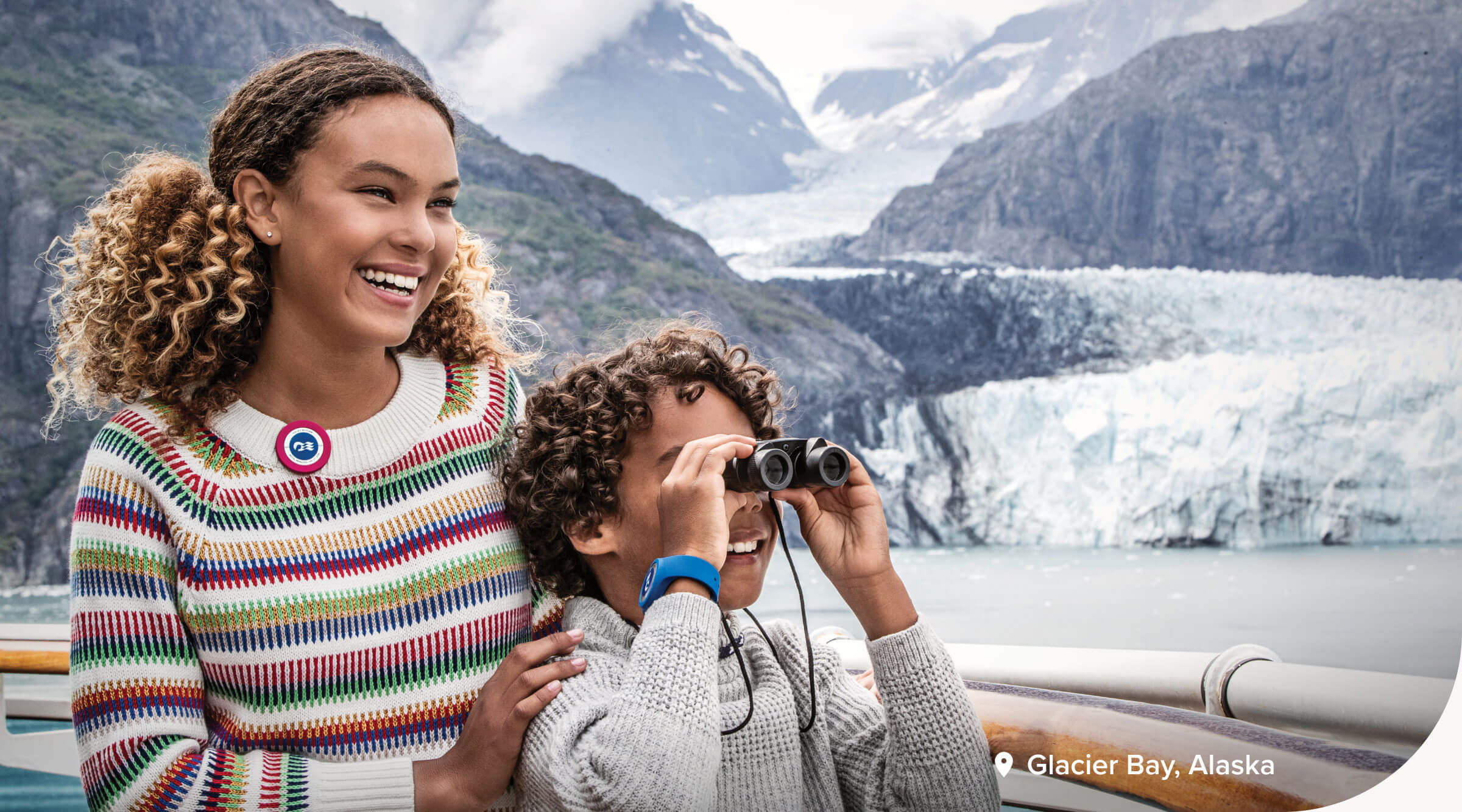 Two children looking outward at Glacier Bay, Alaska.